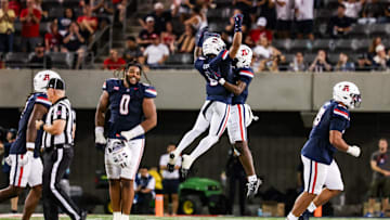 Sep 12, 2025; Tucson, Arizona, USA; Arizona Wildcats defensive back Jay’Vion Cole (8) celebrates with teammate during the third quarter of the game against the Kansas State Wildcats at Arizona Stadium. Mandatory Credit: Aryanna Frank-Imagn Images