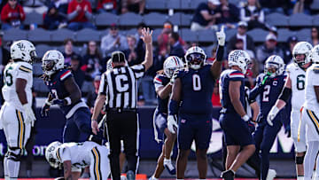 Nov 22, 2025; Tucson, Arizona, USA; Arizona Wildcats defensive lineman Deshawn McKnight (0) celebrates during the first quarter of the game against the Baylor Bears at Casino Del Sol Stadium. Mandatory Credit: Aryanna Frank-Imagn Images