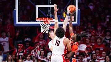 Dec 6, 2025; Tucson, Arizona, USA; Arizona Wildcats center Motiejus Krivas (13) blocks a lay up attempted by Auburn Tigers forward KeShawn Murphy (3) during the second half of the game at McKale Memorial Center. Mandatory Credit: Aryanna Frank-Imagn Images