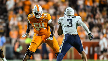 Sep 17, 2022; Knoxville, Tennessee, USA; Tennessee Volunteers offensive lineman Gerald Mincey (54) blocks Akron Zips wide receiver Daniel George (3) during the first half at Neyland Stadium. Mandatory Credit: Bryan Lynn-USA TODAY Sports