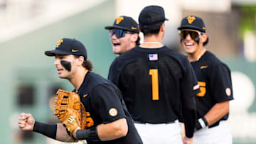 Tennessee infielders celebrate an umpire review that led to a double play during a college baseball game between Tennessee and Vanderbilt at Lindsey Nelson Stadium in Knoxville, Tenn., on May 9, 2025.