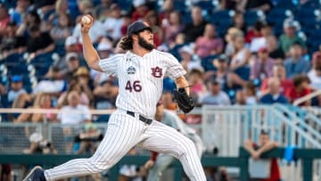 Jun 21, 2022; Omaha, NE, USA; Auburn Tigers pitcher Chase Allsup (46) pitches against the Arkansas Razorbacks during the eighth inning at Charles Schwab Field. Mandatory Credit: Dylan Widger-USA TODAY Sports