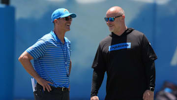 Jun 16, 2025; El Segundo, CA, USA; Los Angeles Chargers coach Jim Harbaugh (left) and executive director of player performance Ben Herbert during organized team activities at The Bolt. Mandatory Credit: Kirby Lee-Imagn Images