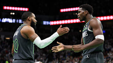 Nov 29, 2024; Minneapolis, Minnesota, USA; Minnesota Timberwolves guard Anthony Edwards (5) and guard Mike Conley (10) celebrate their teams win after an NBA Cup game against the LA Clippers at Target Center. Mandatory Credit: Matt Krohn-Imagn Images