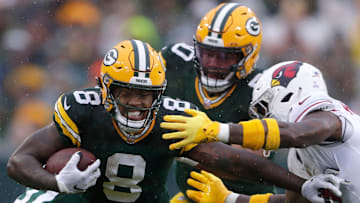 Green Bay Packers running back Josh Jacobs (8) rushes against the Arizona Cardinals on Sunday, Oct. 13, 2024, at Lambeau Field in Green Bay.