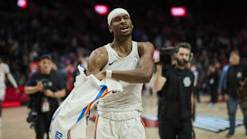 Jan 26, 2025; Portland, Oregon, USA; Oklahoma City Thunder guard Shai Gilgeous-Alexander (2) gives his shirt away to a fan after a game against the Portland Trail Blazers at Moda Center. Mandatory Credit: Troy Wayrynen-Imagn Images