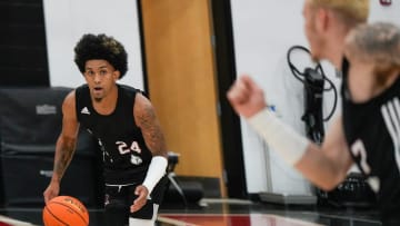 Chucky Hepburn dribbles up court during practice before the Cards head to the Bahamas. July 26, 2024