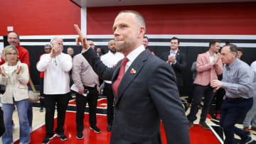 Louisville basketball coach Pat Kelsey gives the “L’s” up sign as he arrives for his introduction as head coach on Thursday, March 28, 2024