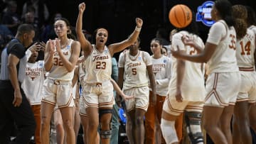 Mar 29, 2024; Portland, OR, USA; Texas Longhorns forward Aaliyah Moore (23) celebrates with teammates after a game against the Gonzaga Bulldogs in the semifinals of the Portland Regional of the 2024 NCAA Tournament at the Moda Center at the Moda Center. Mandatory Credit: Troy Wayrynen-USA TODAY Sports