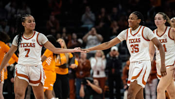 Texas Longhorns forward Madison Booker (35) and guard Jordan Lee (7) celebrate a play late in the second half as the Texas Longhorns take on the Tennessee Lady Vols in the Moody Center, Jan. 23, 2025.