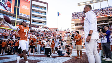 Texas Longhorns head coach Steve Sarkisian embraces defensive back Jahdae Barron (7) as Barron is honored as one of Texas's seniors in their last home game.