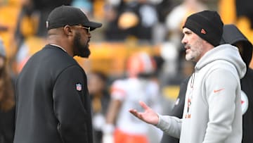 Jan 8, 2023; Pittsburgh, Pennsylvania, USA;  Pittsburgh Steelers head coach Mike Tomlin (left) meets with Cleveland Browns head coach Kevin Stefanski before their game at Acrisure Stadium. Mandatory Credit: Philip G. Pavely-Imagn Images