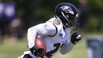 May 26, 2021; Owings Mills, Maryland, USA; Baltimore Ravens running back J.K. Dobbins (27) carries the ball during an OTA at Under Armour Performance Center. Mandatory Credit: Scott Taetsch-Imagn Images