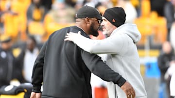 Jan 8, 2023; Pittsburgh, Pennsylvania, USA;  Pittsburgh Steelers head coach Mike Tomlin (left) meets with Cleveland Browns head coach Kevin Stefanski before their game at Acrisure Stadium. Mandatory Credit: Philip G. Pavely-Imagn Images