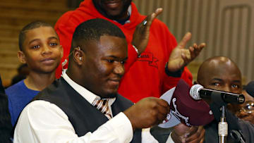 Feb 4, 2015; Gladewater, TX, USA; Daylon Mack dons a Texas A&M hat announcing that he is signing
