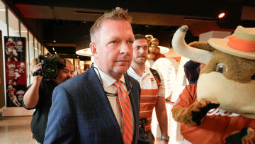 University of Texas baseball coach Jim Schlossnagle arrives at his introductory news conference at the Frank Denius Family University Hall of Fame Wednesday June 26, 2024.
