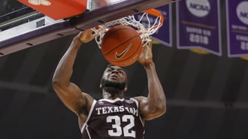 Feb 29, 2020; Baton Rouge, Louisiana, USA;  Texas A&M Aggies forward Josh Nebo (32) dunks the ball against LSU Tigers during the second half at Maravich Assembly Center. Mandatory Credit: Stephen Lew-USA TODAY Sports