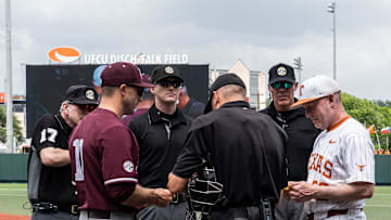 Texas Head Coach Jim Schlossnagle, far right, meets with umpires and Texas A&M Head Coach Michael Earley as the Longhorns prepare to play the Texas A&M Aggies in the second game of a three-game series on Saturday afternoon at UFCU Disch-Falk Field in Austin, April 26, 2025.