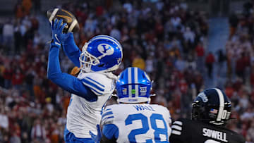 BYU Cougars cornerback Evan Johnson (0) intercepts the ball around Iowa State Cyclones' wide receiver Chase Sowell (0) during the fourth quarter at Jack Trice Stadium on Oct. 25, 2025, in Ames, Iowa.