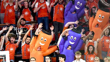 Feb 26, 2025; Clemson, South Carolina, USA; Clemson basketball fans try to distract a Notre Dame free throw shooter during the second half at Littlejohn Coliseum. Mandatory Credit: Ken Ruinard-Imagn Images
