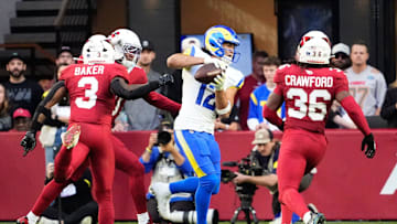 Los Angeles Rams wide receiver Puka Nacua (12) makes a touchdown catch past Arizona Cardinals safety Budda Baker (3) in the first half at State Farm Stadium on Dec 7, 2025, in Glendale, Ariz.