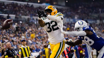 Green Bay Packers running back MarShawn Lloyd (32) and Indianapolis Colts cornerback Chris Lammons (38) miss a long pass on Saturday, Aug. 16, 2025, during a game against the Green Bay Packers at Lucas Oil Stadium in Indianapolis.