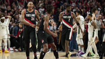 Jan 31, 2024; Portland, Oregon, USA; Portland Trail Blazers forward Jabari Walker (34) celebrates with forward Jerami Grant (9) after beating the Milwaukee Bucks at Moda Center. Mandatory Credit: Troy Wayrynen-USA TODAY Sports