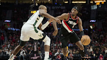 Jan 31, 2024; Portland, Oregon, USA; Portland Trail Blazers forward Jerami Grant (9) drives to the basket during the second half against Milwaukee Bucks forward Khris Middleton (22) at Moda Center. Mandatory Credit: Troy Wayrynen-Imagn Images