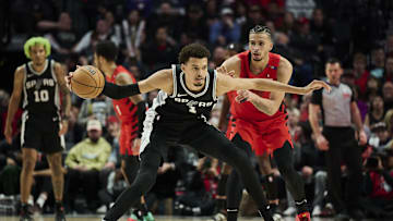 Dec 13, 2024; Portland, Oregon, USA; San Antonio Spurs center Victor Wembanyama (1) dribbles the basketball during the second half against Portland Trail Blazers forward Toumani Camara (33) at Moda Center. Mandatory Credit: Troy Wayrynen-Imagn Images