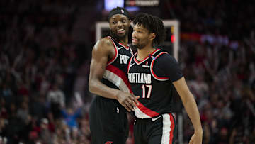 Feb 22, 2025; Portland, Oregon, USA; Portland Trail Blazers forward Jerami Grant (9) celebrates with Portland Trail Blazers guard Shaedon Sharpe (17) during the second half against the Charlotte Hornets at Moda Center. Mandatory Credit: Troy Wayrynen-Imagn Images