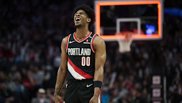 Feb 22, 2025; Portland, Oregon, USA; Portland Trail Blazers guard Scoot Henderson (00) reacts after missing a three point basket during the second half against the Charlotte Hornets at Moda Center. Mandatory Credit: Troy Wayrynen-Imagn Images