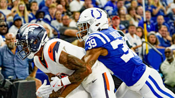 Indianapolis Colts cornerback Darrell Baker Jr. (39) disrupts a end zone catch by Denver Broncos wide receiver Josh Reynolds (11) during a pre-season game between the Indianapolis Colts and the Denver Broncos on Sunday, August. 11, 2024 at Lucas Oil Stadium in Indianapolis.