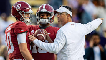 Alabama quarterback Tua Tagovailoa (13), quarterback Mac Jones (10) and quarterbacks coach Dan Enos before the LSU game at Tiger Stadium in Baton Rouge, La., on Saturday November 3, 2018