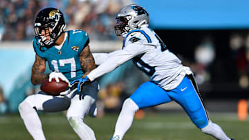 Jacksonville Jaguars tight end Evan Engram (17) pulls in a first down pass while being defended by Carolina Panthers tight end Chris Pierce Jr. (48) during third quarter action. The Jacksonville Jaguars hosted the Carolina Panthers at EverBank Stadium in Jacksonville, FL Sunday, December 31, 2023. 