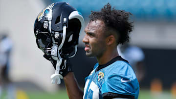 Jaguars WR (13) Christian Kirk takes off his helmet on a break between drills during the Jacksonville Jaguars Organized Team Activity session at TIAA Bank Field Monday, May 23, 2022.