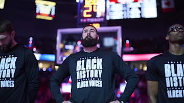 Feb 6, 2025; Portland, Oregon, USA; Sacramento Kings center Jonas Valanciunas (17) stands during the singing of the national anthem before a game against the Portland Trail Blazers at Moda Center. Mandatory Credit: Troy Wayrynen-Imagn Images