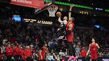 Feb 6, 2025; Portland, Oregon, USA; Sacramento Kings guard Zach LaVine (8) dunks the basketball during the second half against Portland Trail Blazers forward Toumani Camara (33) at Moda Center. Mandatory Credit: Troy Wayrynen-Imagn Images