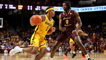 Nov 25, 2024; Minneapolis, Minnesota, USA; Minnesota Golden Gophers guard Isaac Asuma (1) drives towards the basket as Central Michigan Chippewas guard Jakobi Heady (0) defends during the first half at Williams Arena. Mandatory Credit: Matt Krohn-Imagn Images
