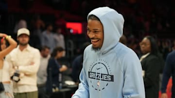 Oct 17, 2025; Miami, Florida, USA;  Memphis Grizzlies guard Ja Morant (12) who did not play due to injury, leaves the court after the Memphis Grizzlies defeat the Miami Heat at Kaseya Center. Mandatory Credit: Jim Rassol-Imagn Images