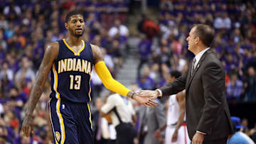 Apr 18, 2016; Toronto, Ontario, CAN; Indiana Pacers forward Paul George (13) is congratulated by head coach Frank Vogel as he comes out of the game in the first half against the Toronto Raptors in game two of the first round of the 2016 NBA Playoffs at Air Canada Centre. The Raptors beat the Pacers 98-87. Mandatory Credit: Tom Szczerbowski-Imagn Images