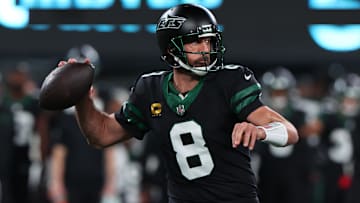 Oct 31, 2024; East Rutherford, New Jersey, USA; New York Jets quarterback Aaron Rodgers (8) throws a pass against the Houston Texans during the first half at MetLife Stadium. Mandatory Credit: Ed Mulholland-Imagn Images