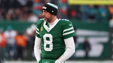 Jan 5, 2025; East Rutherford, New Jersey, USA; New York Jets quarterback Aaron Rodgers (8) looks on during the first quarter of their game against the Miami Dolphins at MetLife Stadium. Mandatory Credit: Ed Mulholland-Imagn Images