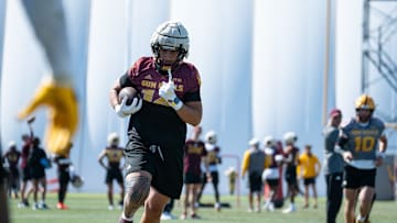Tight end AJ Ia (14) works out at Sun Devils spring football practice at ASU's Kajikawa practice fields on March 27, 2025, in Tempe, Ariz.