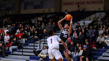 Serra's Maximo Adams (25) looks to pass while covered by Indio's Jerry Perkins (1) during the first quarter of their first-round CIF-SS playoff game at Indio High School in Indio, Calif., Wednesday, Feb. 7, 2024.