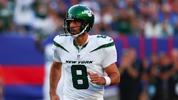 Aug 26, 2023; East Rutherford, New Jersey, USA; New York Jets quarterback Aaron Rodgers (8) celebrates his touchdown pass against the New York Giants during the first half at MetLife Stadium.