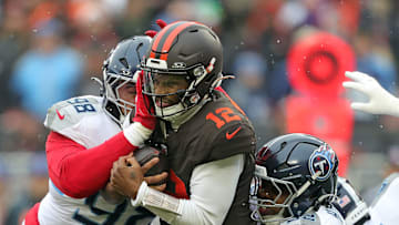 Cleveland Browns quarterback Shedeur Sanders is sacked by Tennessee Titans defensive tackle Jeffery Simmons.