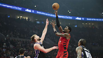 Feb 6, 2025; Portland, Oregon, USA;Portland Trail Blazers center Deandre Ayton (2) shoots a jump shot the ball during the first half against Sacramento Kings forward Domantas Sabonis (11) at Moda Center. Mandatory Credit: Troy Wayrynen-Imagn Images
