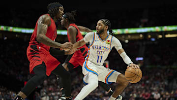 Jan 26, 2025; Portland, Oregon, USA; Oklahoma City Thunder guard Isaiah Joe (11) dribbles the ball during the second half against Portland Trail Blazers center Robert Williams III (35) at Moda Center. Mandatory Credit: Troy Wayrynen-Imagn Images
