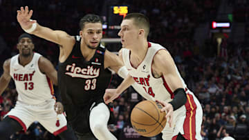Jan 11, 2025; Portland, Oregon, USA; Miami Heat guard Tyler Herro (14) drives to the basket during the second half against Portland Trail Blazers forward Toumani Camara (33) at Moda Center. Mandatory Credit: Troy Wayrynen-Imagn Images