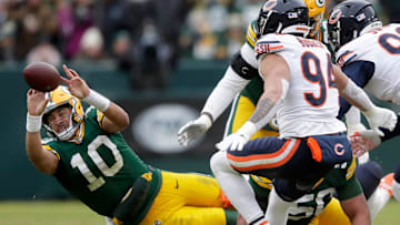 Green Bay Packers quarterback Jordan Love (10) is tackled by Chicago Bears defensive tackle Gervon Dexter Sr. (99) against the Chicago Bears on Sunday, January 5, 2024 at Lambeau Field in Green Bay, Wis. 
Wm. Glasheen USA TODAY NETWORK-Wisconsin